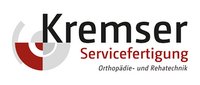 Logo Kremser Servicefertigung Logo der Kremser Servicefertigung mit rotem und grauem Kreiselement